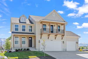 View of front of house featuring a mountain view, a shingled roof, driveway, and covered porch