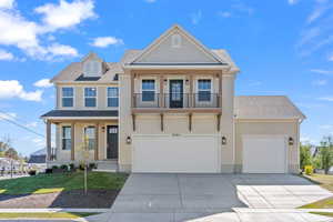 Craftsman-style home with roof with shingles, a porch, concrete driveway, and a balcony