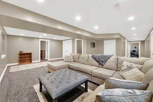 Carpeted family room featuring recessed lighting