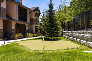 Surrounding community featuring a putting green
