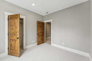 Carpeted bedroom featuring baseboards and recessed lighting