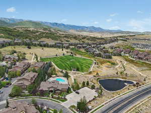 Aerial view of property's location with nearby suburban area and a water and mountain view