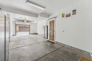 Garage featuring baseboards