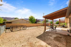 Fenced backyard, covered patio and garden area