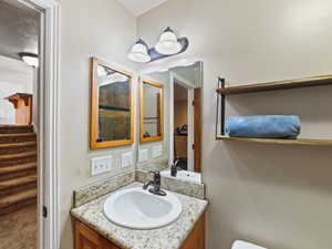 Bathroom featuring vanity and toilet