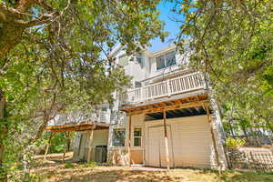 Rear view of property featuring a deck