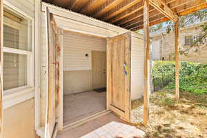 Property entrance with a patio