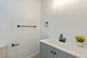 Bathroom with vanity and toilet