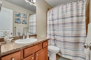 Full bathroom featuring vanity and light tile patterned floors