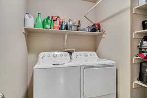 Laundry area featuring separate washer and dryer