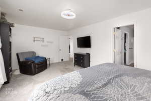 Bedroom with carpet and baseboards