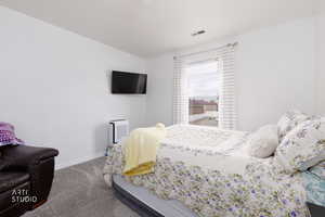 Carpeted bedroom with baseboards