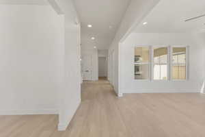 Unfurnished room with recessed lighting and light wood-type flooring