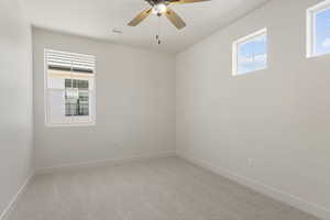 Unfurnished room with light carpet and ceiling fan