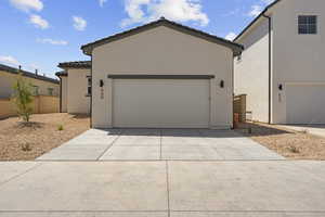 Garage featuring driveway