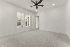Unfurnished room with light carpet, recessed lighting, and a ceiling fan