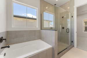 Full bath with a shower stall, a garden tub, tile patterned floors, and recessed lighting
