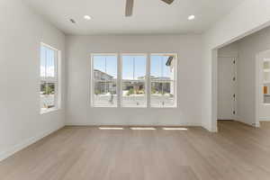 Unfurnished living room with recessed lighting, light wood-style flooring, and a ceiling fan