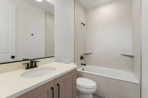 Full bath with bathing tub / shower combination and vanity