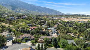 Aerial view of residential area featuring a mountainous background