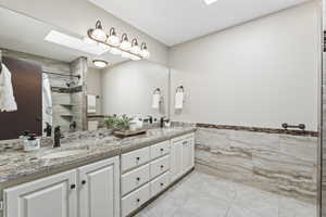 Updated Full bathroom with double sinks and skylight.