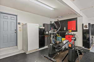 Large, extra depth garage with ample area for workbench, storage cabinets and more.