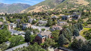 Aerial overview of property's location featuring mountains and nearby suburban area