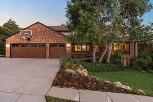 Front of home featuring an attached 3 car extended depth garage