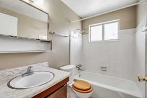 Full bath with vanity and bathtub / shower combination