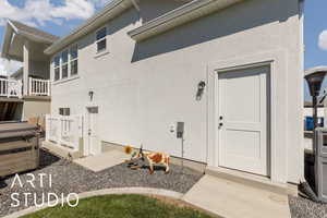 Doorway to property with stucco siding