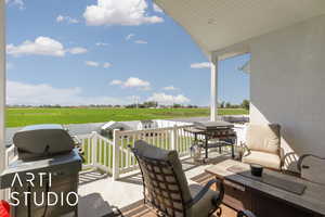 View of patio with grilling area and a view of rural / pastoral area