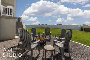 View of patio / terrace with a fire pit and stairs