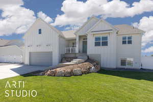 View of front of property featuring board and batten siding, driveway, a shingled roof, and an attached garage
