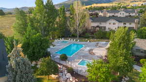 Aerial view of a mountain backdrop and a pool