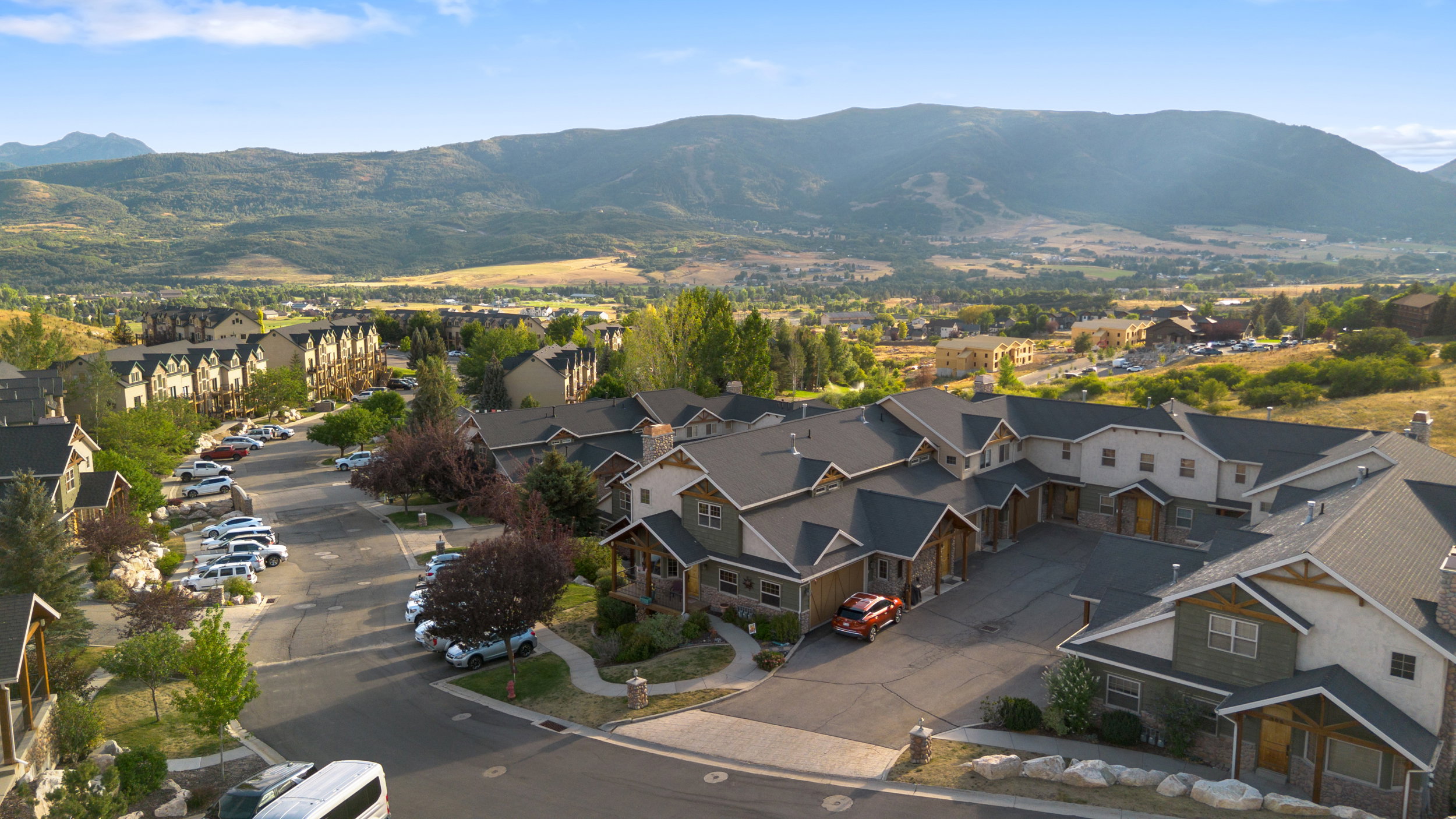 View of property location featuring mountains and nearby suburban area