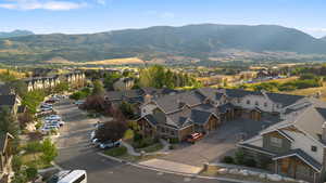 View of property location featuring mountains and nearby suburban area