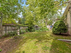 View of fenced backyard