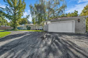 Garage with asphalt driveway