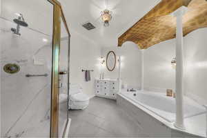 Full bath with ornamental molding, a garden tub, a marble finish shower, vanity, and light tile patterned floors