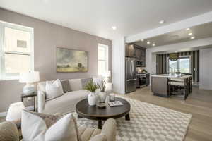 The heart of the home with large windows, great flow, and a vibe that's both relaxing and stylish. *model home
