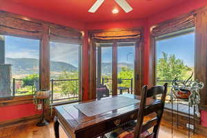 Library or Office with wall of windows, custom drapery and custom floor to ceiling book shelves.