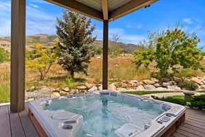 Private hot tub deck just outside main level primary suite.