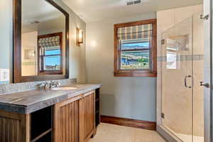 En-Suite second level primary bathroom with tiled shower.