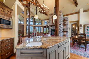 Custom kitchen with Wolf Appliances, Adler Wood cabinets and granite counters. Large island for eating and entertaining. Open concept into the dining room and living room.