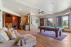 Rec room for movie or game nights. Tall built in book shelves and large windows, allow for multi use of space. Walk out entrance to front yard.