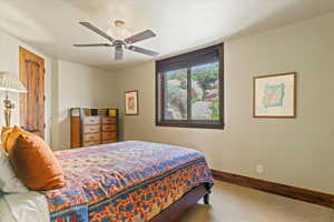 Bedroom in lower level with closet and large window for natural lighting.