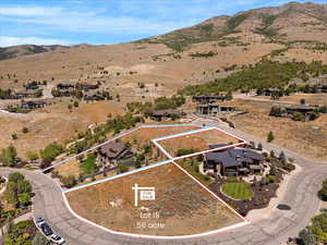 Aerial view of property's location with mountains and property parcel outlined