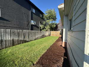 View of fenced backyard