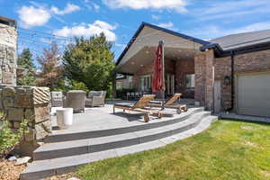 View of patio featuring an outdoor hangout area