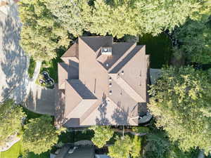 View from above of property featuring a tree filled landscape